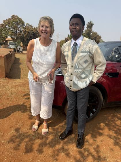 A visiting guest with a young member of the church
