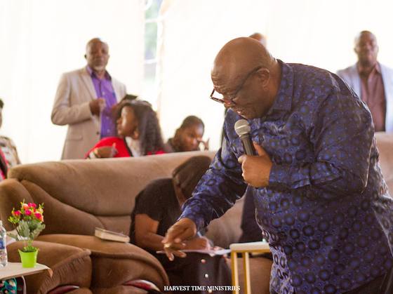A minister preaching among the congregation