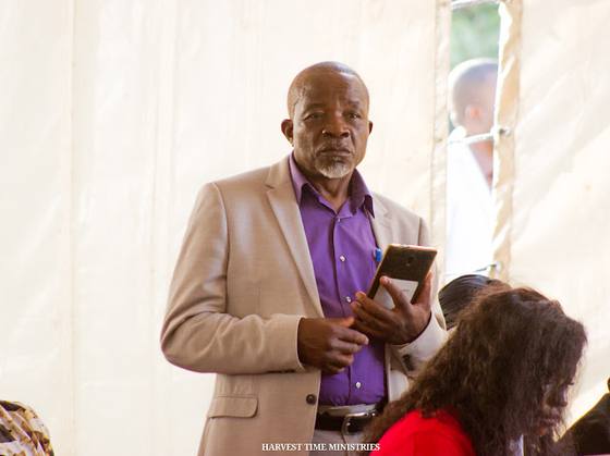 A member standing to share during the service