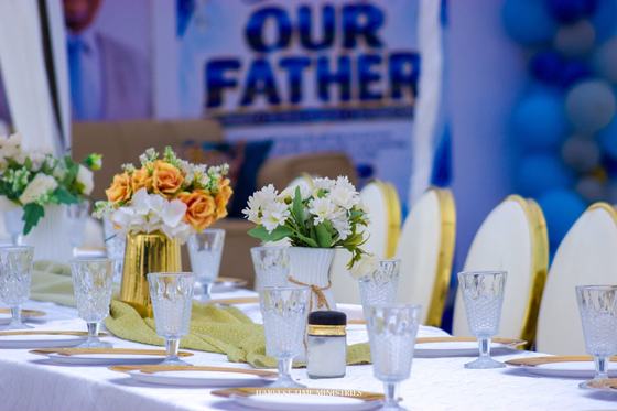 Tables dressed in white and gold for the celebration