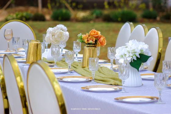 Guest tables set with flowers and glassware